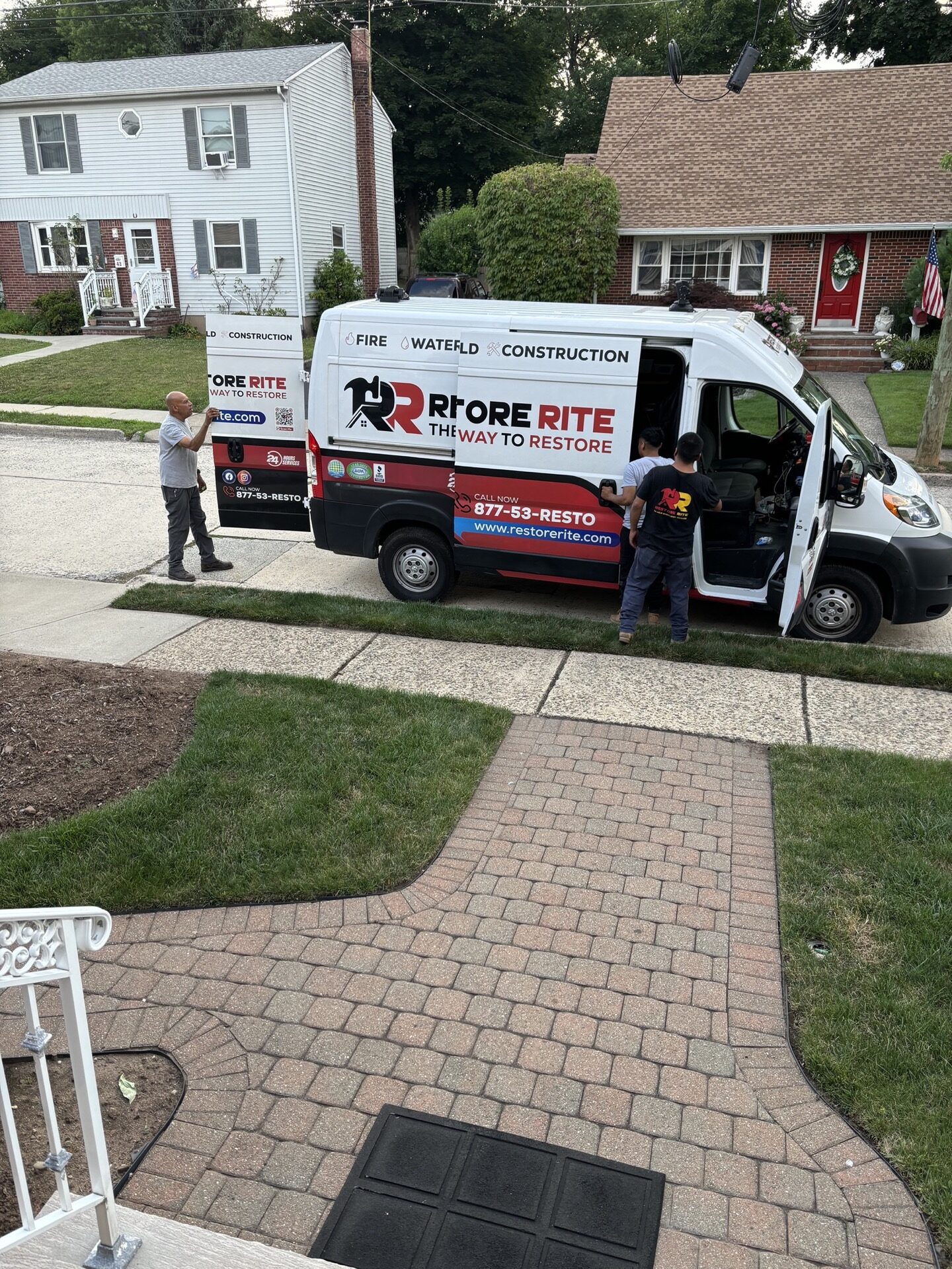 Restore Rite branded van arriving at a Tri-State restoration job site