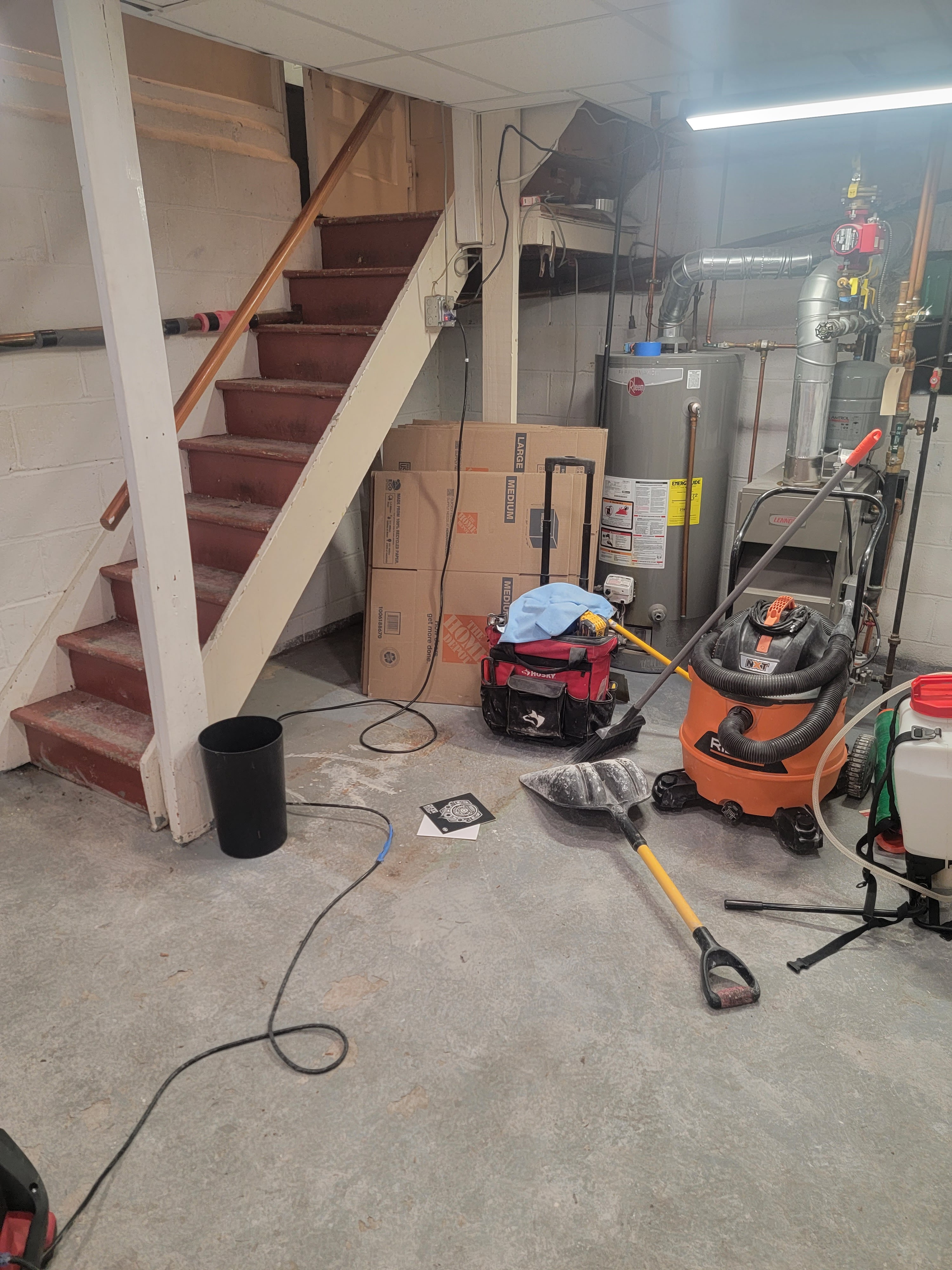 Commercial basement rebuild with utilities reconnected after storm-driven water damage cleanup