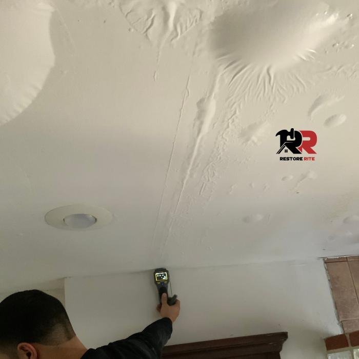 Restore Rite technician documenting damage during an on-site inspection