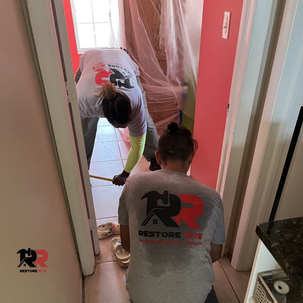 Soaked drywall and flooring removed during water damage cleanup at a Tri-State property